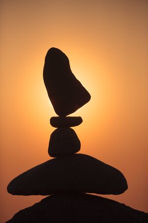 balanced stones on the beachの写真素材