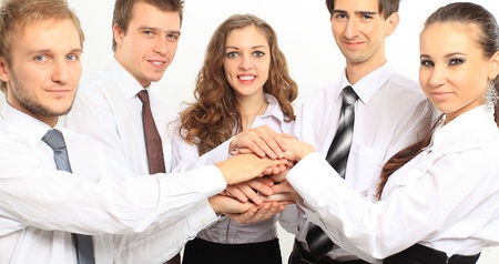 business team putting their hands on top of each other の写真素材