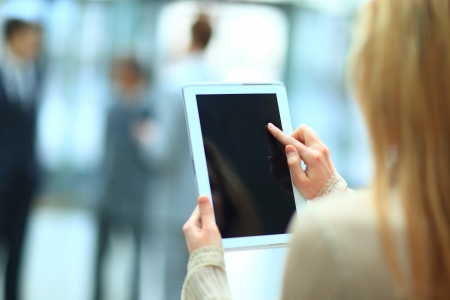 Handsome businesswoman using his digital tablet の写真素材