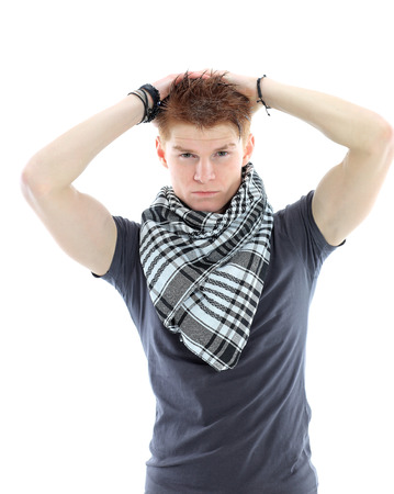 Portrait of handsome young man in casual clothes standing over white の写真素材