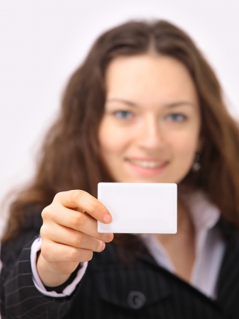 The beautiful business woman shows on a white の写真素材
