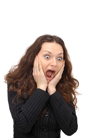 portrait of surprised young woman over grey の写真素材