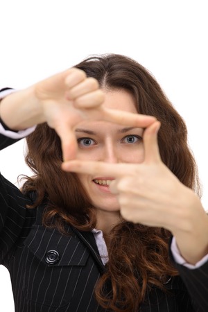 The beautiful business woman in a framework on a white の写真素材
