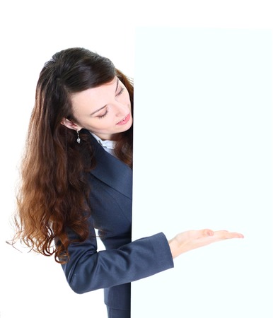 Happy smiling young business woman showing blank signboard, isolated on white の写真素材