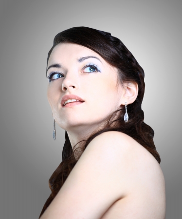 Portrait of beautiful woman, she is isolated on grey の写真素材