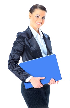 Beautiful young female entrepreneur holding laptop against white background.の写真素材
