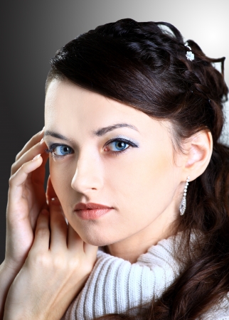 Portrait of a beautiful woman on a black の写真素材