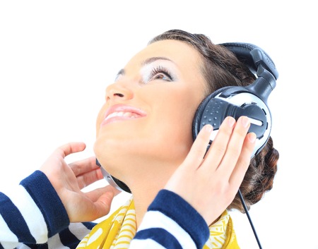 Beautiful girl with headphones. Isolated on a white backgroundの写真素材