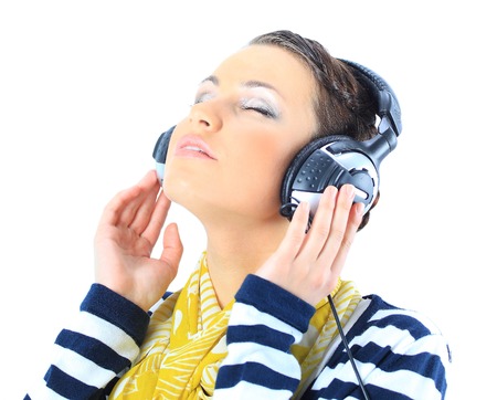 Beautiful girl with headphones. Isolated on a white backgroundの写真素材