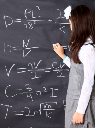 The little girl decides to mathematical equations.の写真素材