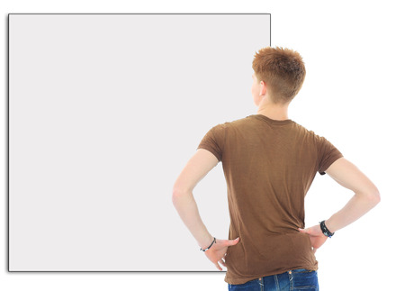 Portrait of handsome young man in casual clothes standing over white backgroundの写真素材