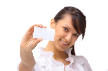 Young happy businesswoman with blank sign or business card, isolatedの写真素材