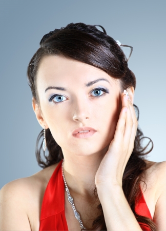 Beautiful, attractive, charming girl . Isolated on a blue background.の写真素材