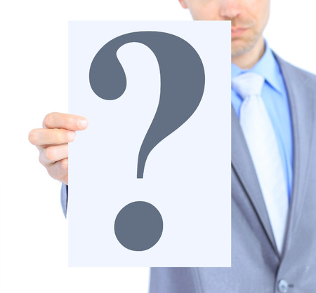 Nice businessman, with a question mark. Isolated on a white background.の写真素材