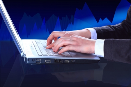 Closeup of businessman typing on laptop computer の写真素材