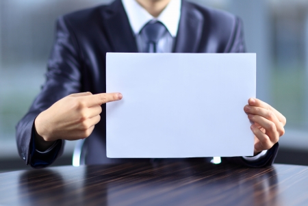 Businessman holding blank paperの写真素材