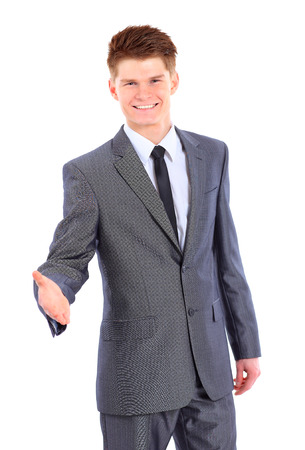 Confident business man giving you a hand shake の写真素材