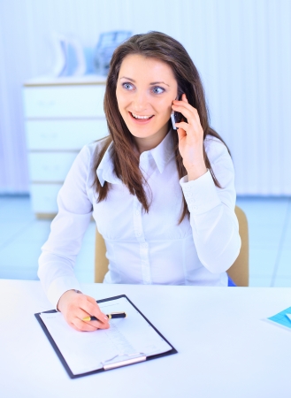 The beautiful business woman at officeの写真素材