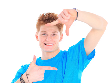 Portrait of handsome young man in casual clothes standing over white 