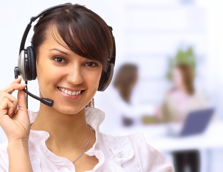 Beautiful woman operator in the office.の写真素材