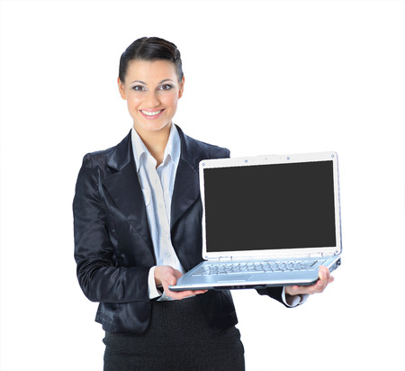 Beautiful businesswoman keeps the laptop. Isolated on a white background.の写真素材