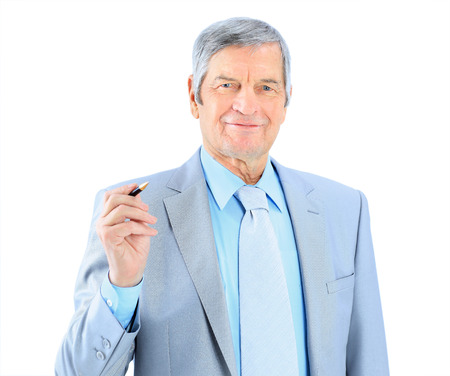 Businessman in age, writes in the air. Isolated on a white background.の写真素材