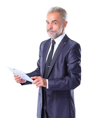 Businessman using a tablet computer - isolated over a white backgroundの写真素材