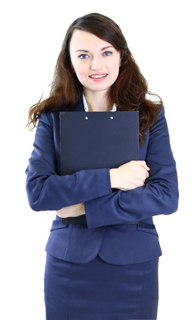 Portrait of a cute young business woman with the work plan smiling, in an office environment.の写真素材
