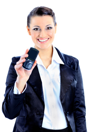 Beautiful business woman points to the phone. Isolated on a white background.の写真素材