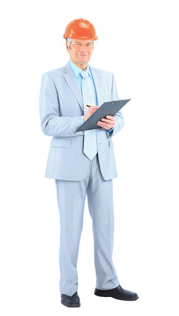 Engineer of age, with a plan reports. Isolated on a white background.の写真素材