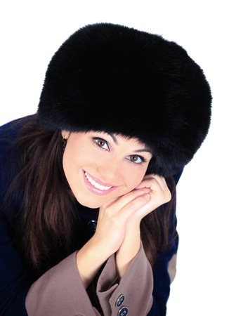 beautiful girl in a fur hatの写真素材