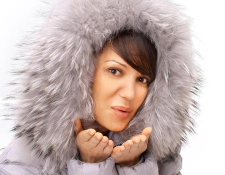 The winter girl sends an air kissの写真素材