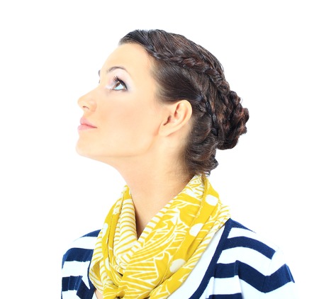 A close-up portrait of a beautiful woman with a yellow scarf. Isolated on a white background.の写真素材