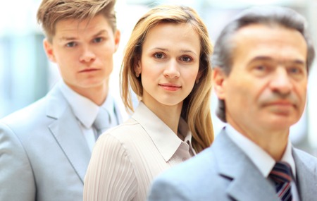 Group portrait of a professional business team looking confidently at cameraの写真素材