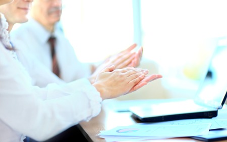 Photo of business partners hands applauding at meetingの写真素材