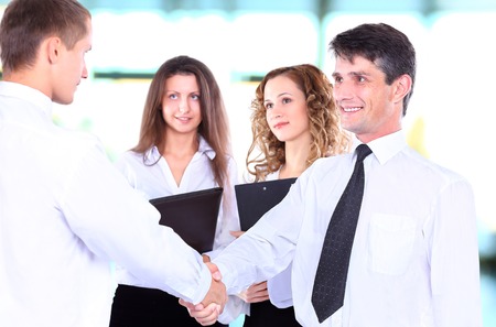 Business people shaking hands, finishing up a meetingの写真素材