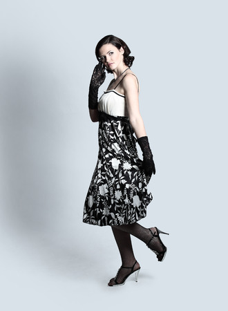 Fashion portrait of young beautiful woman in the black dress の写真素材
