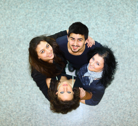 Group of people with hands together showing teamworkの写真素材
