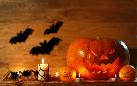 halloween pumpkin on wooden backgroundの写真素材