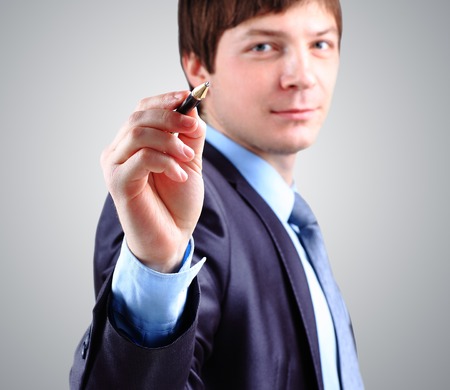 Hand of business man write or writing on tablet pc touch screenの写真素材