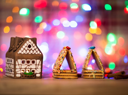 fairy Christmas house cake with candle light inside, narrow depth of field and background lightsの写真素材
