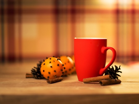 Mug Of Tea Or Coffee. Sweets. Christmas Decorations. Red Balls And Bells. Wooden Background.の写真素材