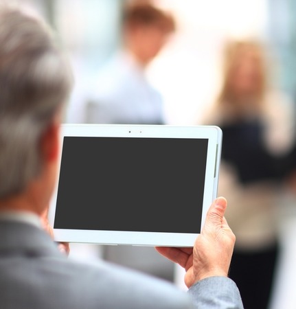 Businessman holding digital tablet