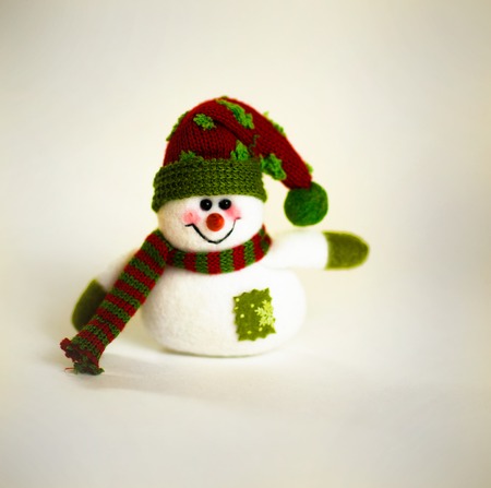 cute snowman with scarf on white backgroundの写真素材