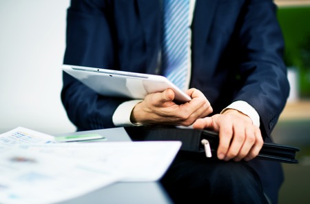 Businessman hands are holding the touch screen device.の写真素材