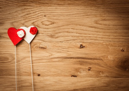 Love hearts on wooden texture background, valentines day card conceptの写真素材