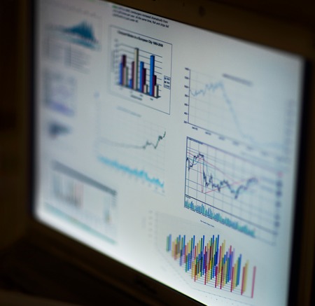 Businessman analyzing investment charts with laptop. Accountingの写真素材