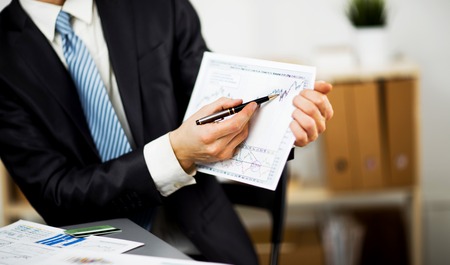 Businessman hands are holding the touch screen device.の写真素材