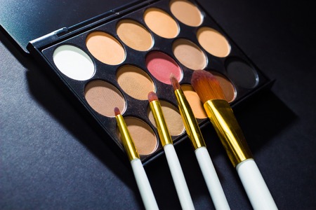 a set of shadows and makeup brushesの写真素材