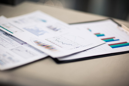 financial charts and graphs on the tableの写真素材